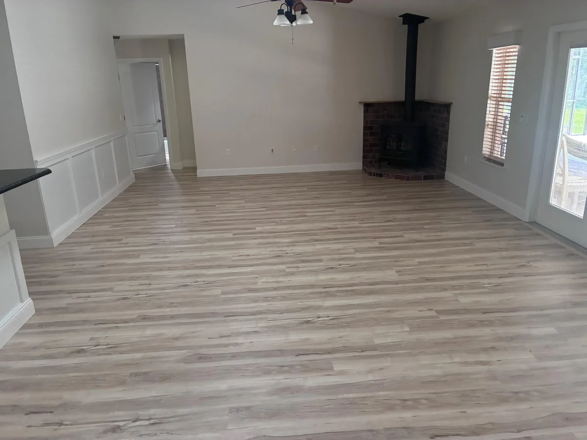 Luxury vinyl plank flooring installed in an Orlando living room and kitchen