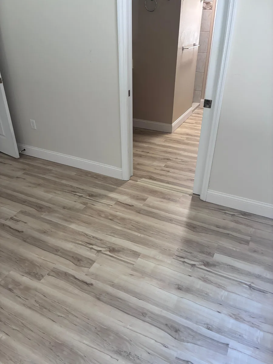 Luxury vinyl plank hallway and bedroom flooring installation