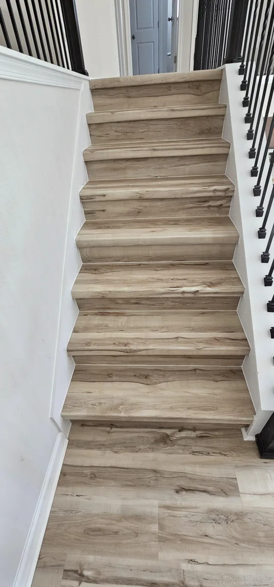 Luxury vinyl plank stairs and second-floor landing installation